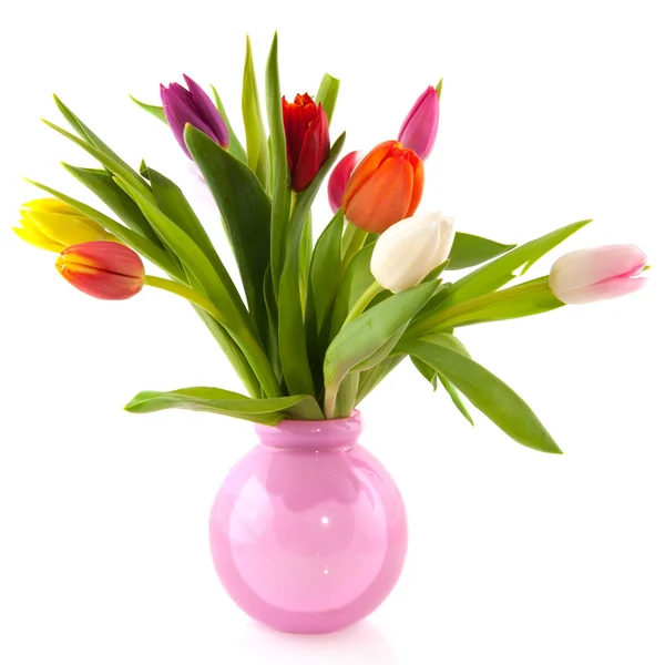 Kleurrijke tulpen in glazen vaas — Stockfoto