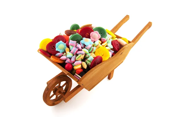 Wiel barrow met veel candy — Stockfoto