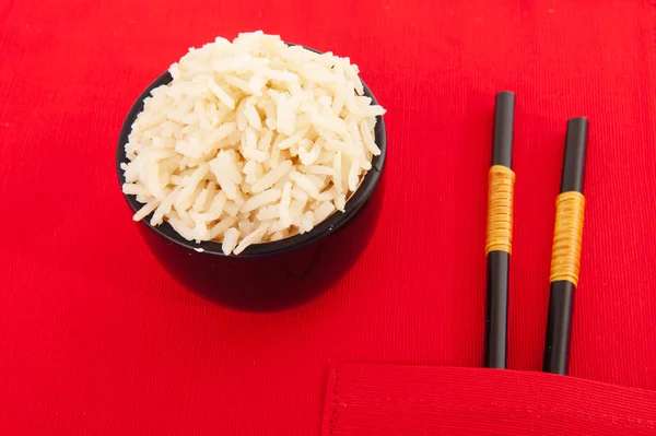 Brown rice with chop sticks — Stock Photo, Image