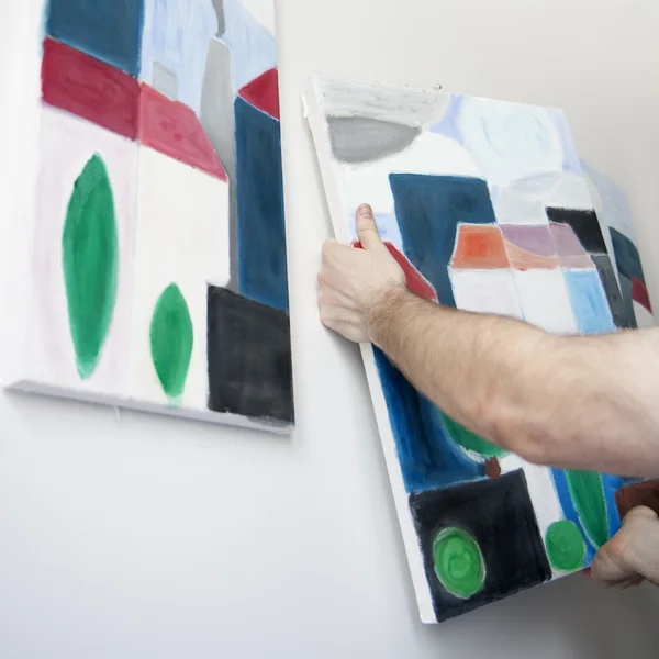 Haning a painting — Stock Photo, Image