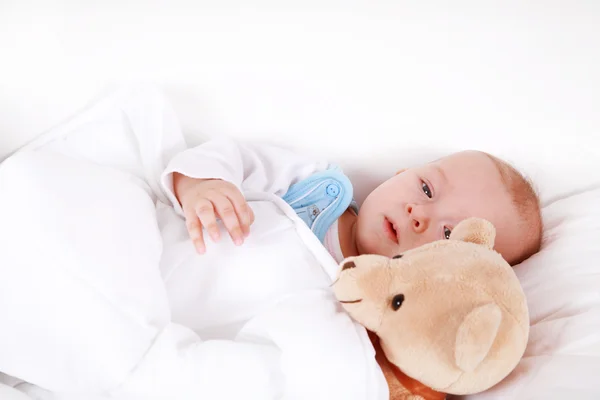 Baby met teddy — Stockfoto