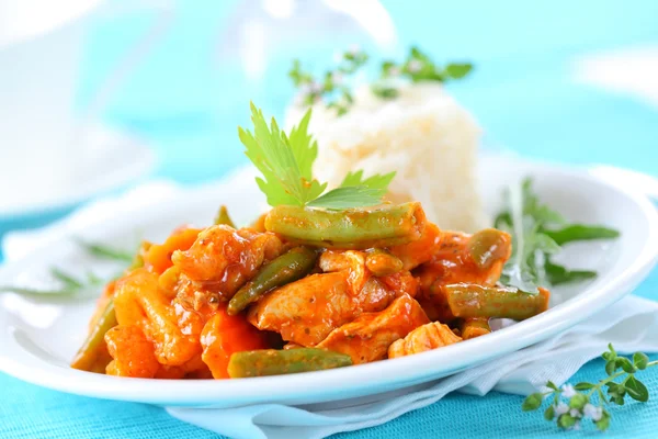 Red chicken curry stripes with rice — Stock Photo, Image