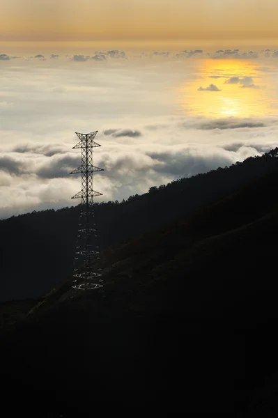 Stock image Electricity pylon over valley at sunset, Lomba das Torres, Madeira island,