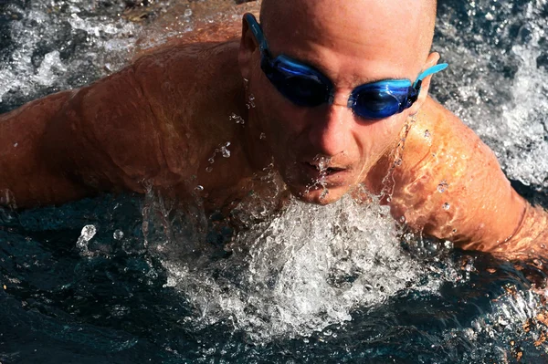 Stock image Detail of young man swimming