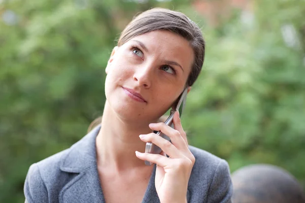 stock image Young business woman with cell phone