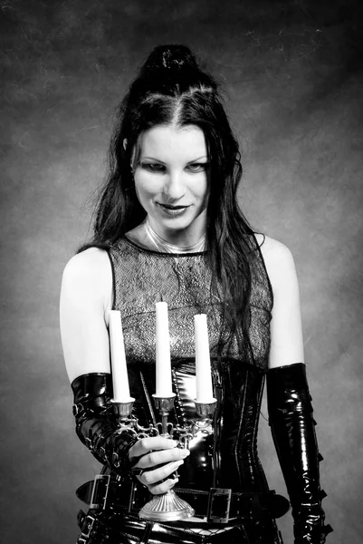 Gothic girl with candles — Stock Photo, Image