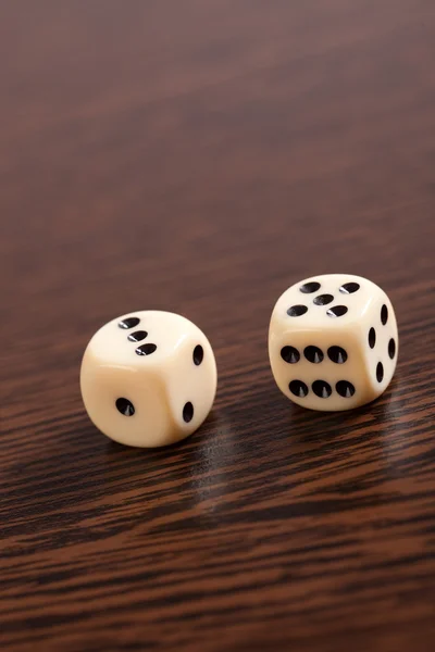 Dice on wooden table — Stock Photo, Image