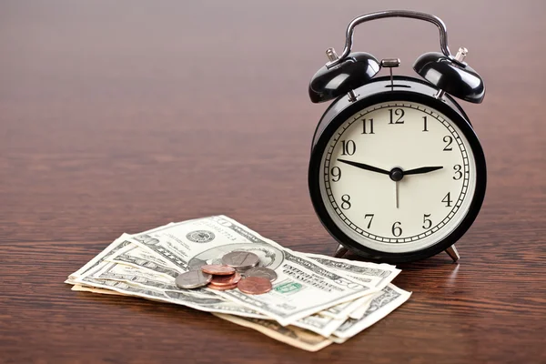 Alarm clock and money — Stock Photo, Image