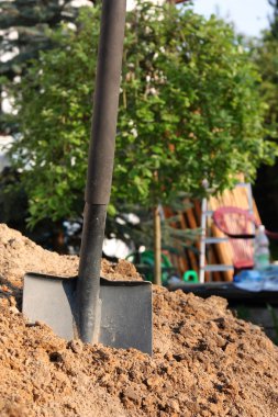 Shovel in the soil clipart