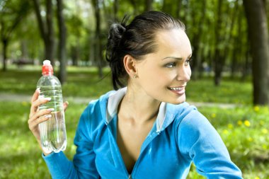 Happy woman with bottle clipart