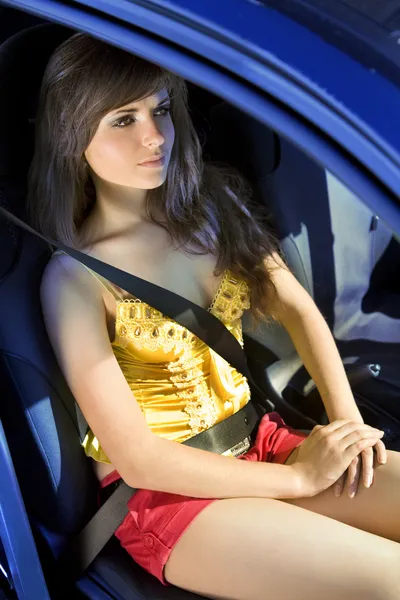 Girl in car fastened by seat belt — Stock Photo, Image