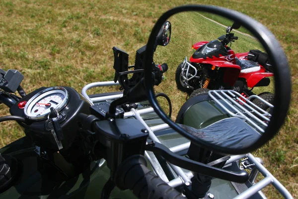 stock image Red quad bike in rear view mirror