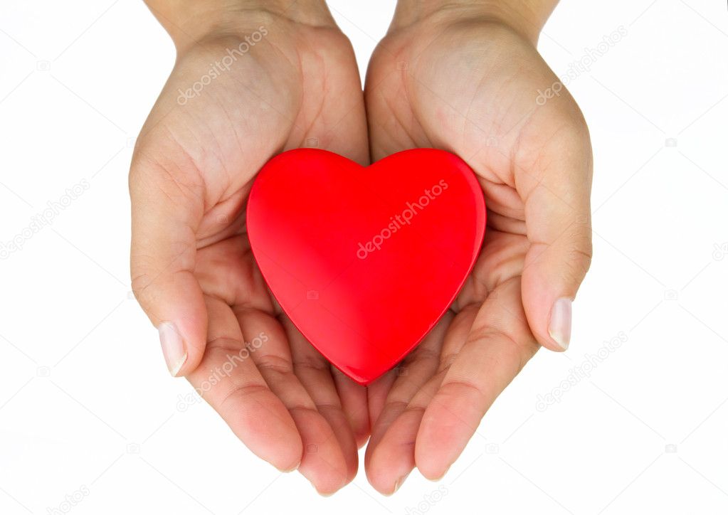 Heart on female hands