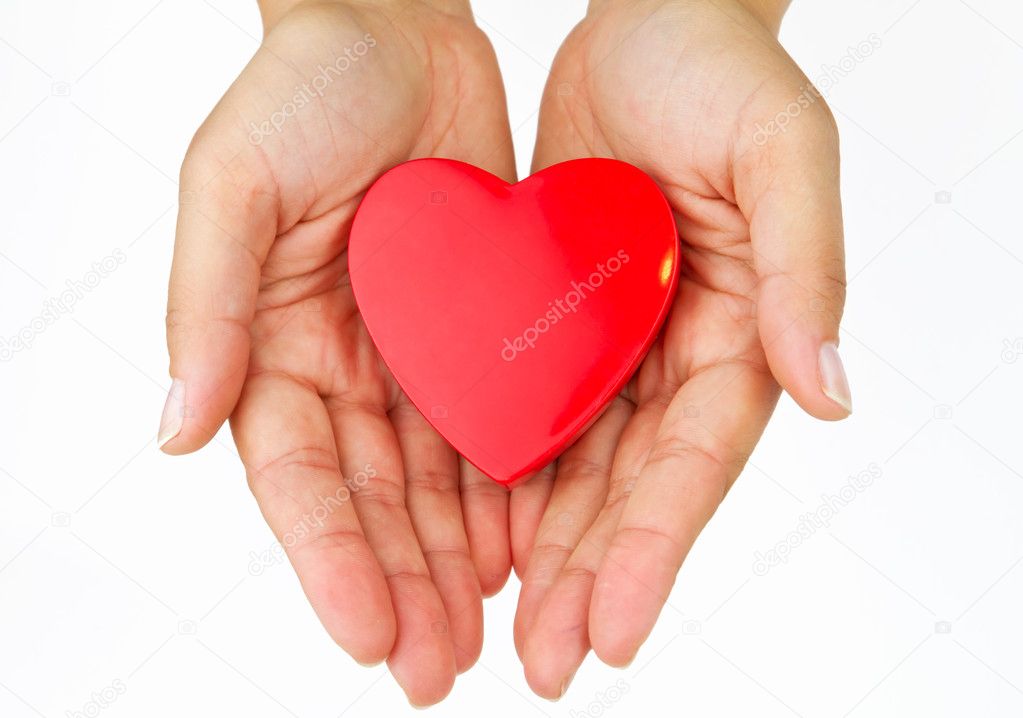 Heart on female hands