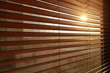 Sunlight behind vertical blinds