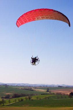 A powered paraglider clipart