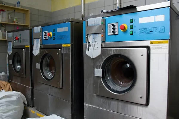 A row of industrial washing machines — Stock Photo, Image
