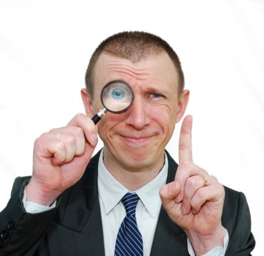 Smiling businessman with a raised finger clipart