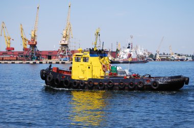 Towboat in the port clipart