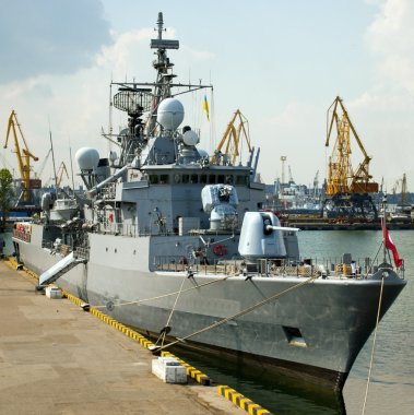 Military ship in the port clipart