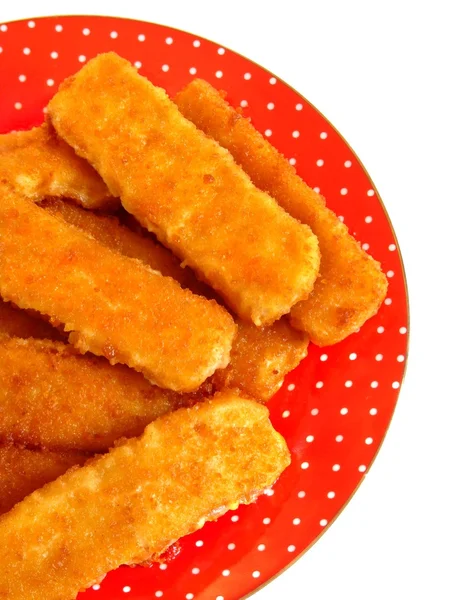 Fish fingers on the red plate. Isolation — Stock Photo, Image
