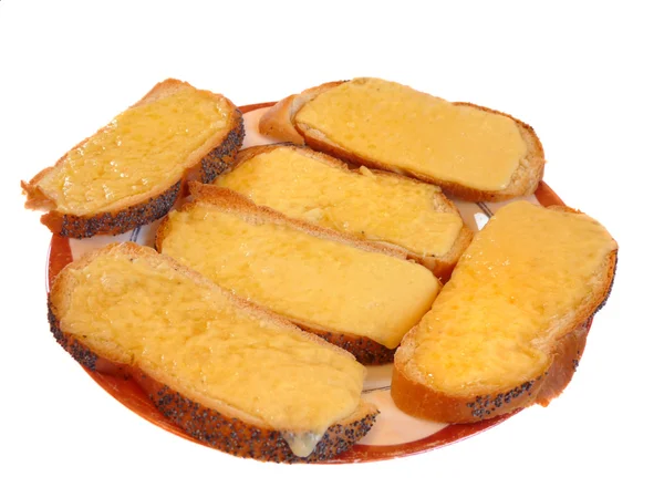 Tostadas con queso derretido sobre blanco. De forma aislada — Foto de Stock