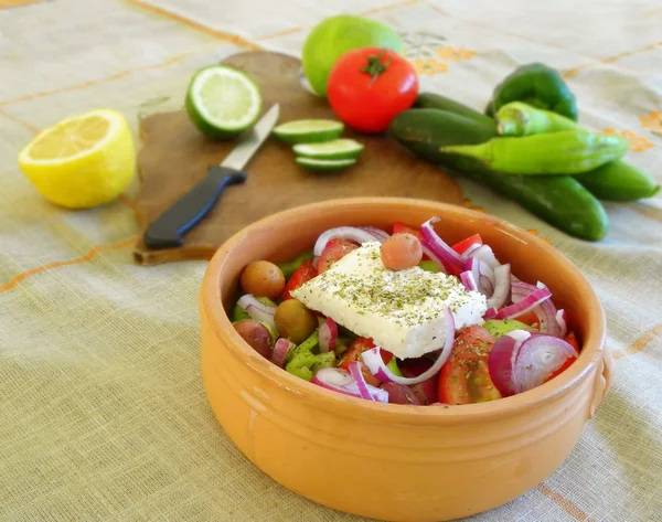 Preparing a Greek salad — Stock Photo, Image