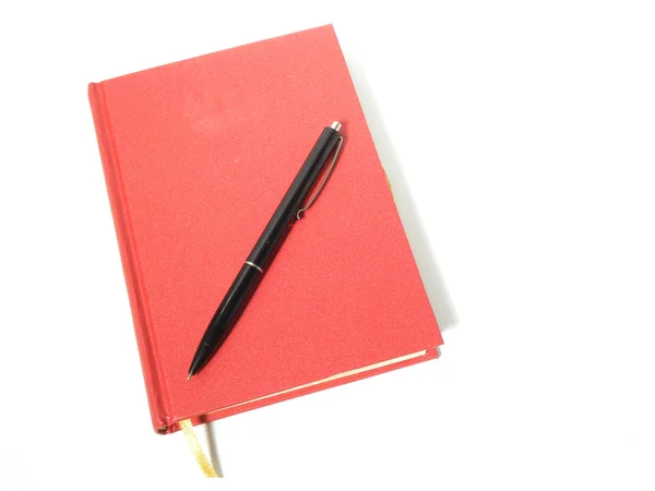 Rotes Notizbuch mit Stift — Stockfoto