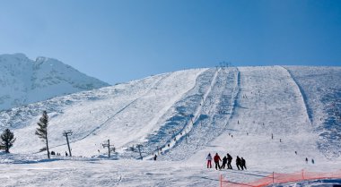 Ski slope at winter resort Bansko, Bulgaria clipart