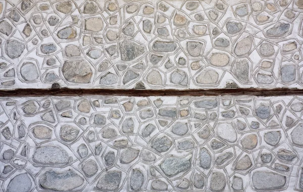 Stare kamienne mozaiki i betonowy mur — Zdjęcie stockowe
