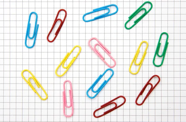 Paper clips on notepad page — Stock Photo, Image