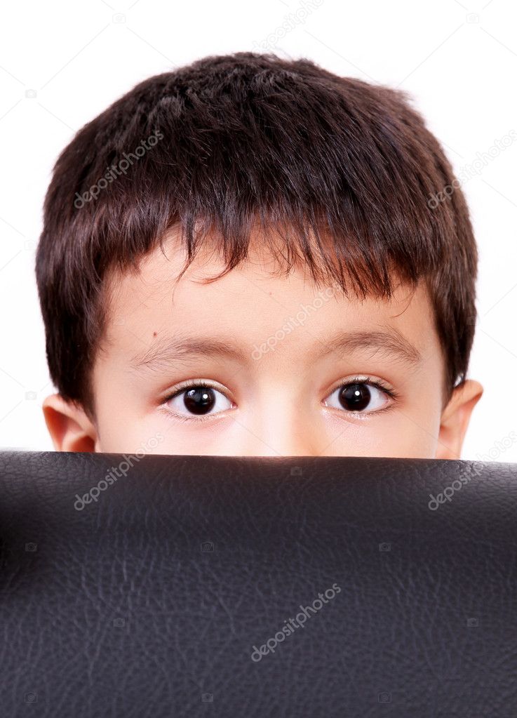 Five years old child discovering something, close up image