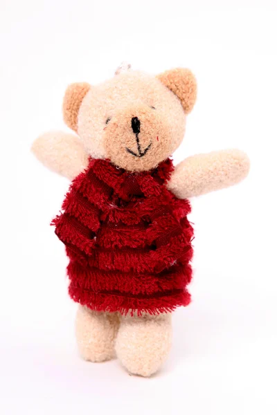 Urso Boneca Com Vestido Vermelho Sobre Fundo Branco — Fotografia de Stock
