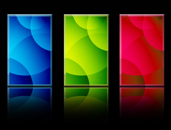 Red, green and blue shapes over black background with reflection