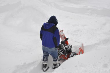 Man Snow Blowing clipart