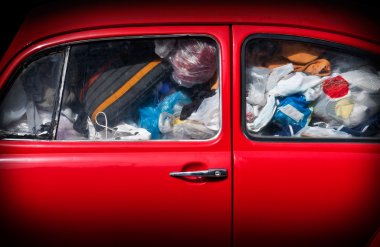 A red car with rubbish. clipart