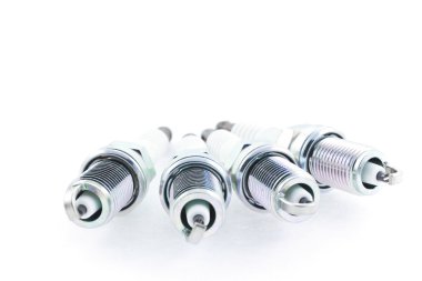 Four Spark Plugs on a white background clipart