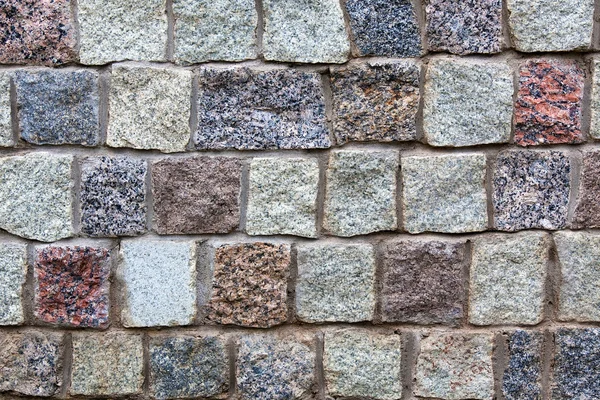 Grijze granieten stenen muur achtergrond — Stockfoto