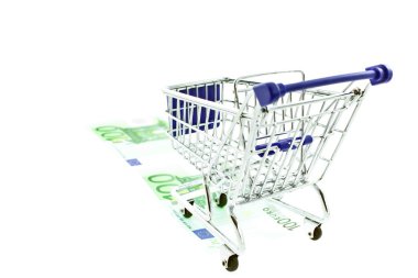 Shopping trolley on 100 euro notes isolated clipart