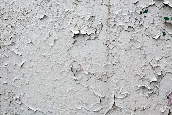 Old gray cracked paint wall background — Stock Photo, Image