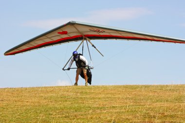 Hang glider flying in the Italian Apennines clipart