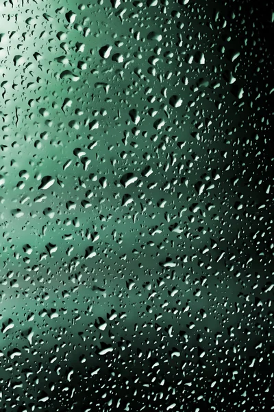 Water droplets as colored background — Stock Photo, Image