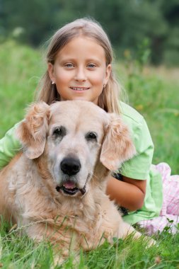 Little girl and her beloved dog clipart