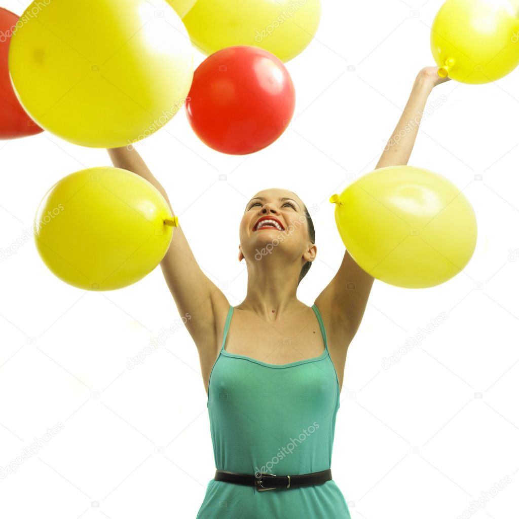 Joyful young woman with balloons