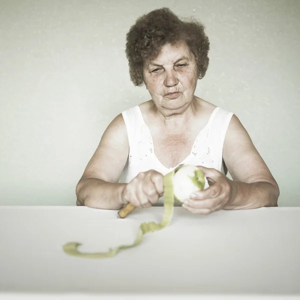 Gracious senior lady portrait with apple — Stock Photo, Image