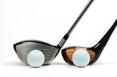 Golf drivers beside one another clipart