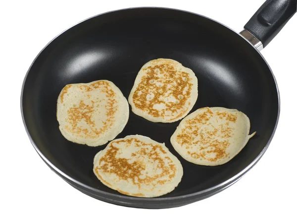 Pancakes cooking in a pan — Stock Photo, Image