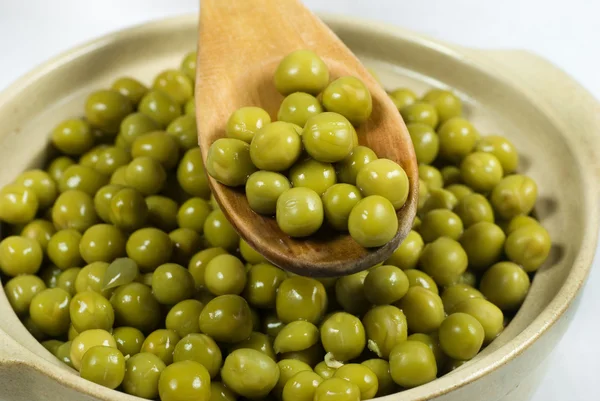 stock image Spoon of green pickle peas