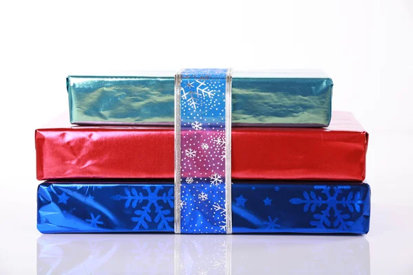 Three shiny colorful Christmas presents — Stock Photo, Image
