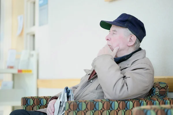 Elderly man deep in thought — Stock Photo, Image